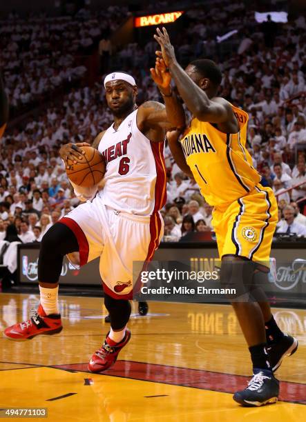 LeBron James of the Miami Heat drives to the basket against Lance Stephenson of the Indiana Pacers during Game Six of the Eastern Conference Finals...