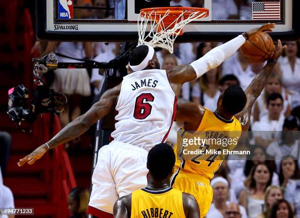 LeBron James of the Miami Heat defends against Paul George of the Indiana Pacers during Game Six of the Eastern Conference Finals of the 2014 NBA...