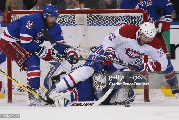 Henrik Lundqvist of the New York Rangers defends the net against Thomas Vanek of the Montreal Canadiens during Game Six of the Eastern Conference...