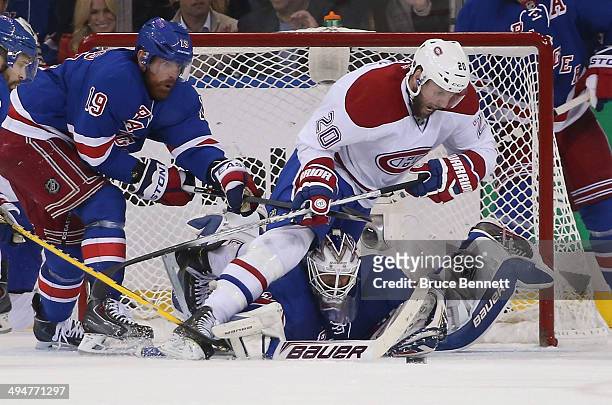 Henrik Lundqvist of the New York Rangers defends the net against Thomas Vanek of the Montreal Canadiens during Game Six of the Eastern Conference...
