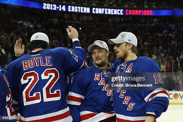 Marc Staal of the New York Rangers celebrateswith teammate Anton Stralman after defeating the Montreal Canadiens in Game Six to win the Eastern...