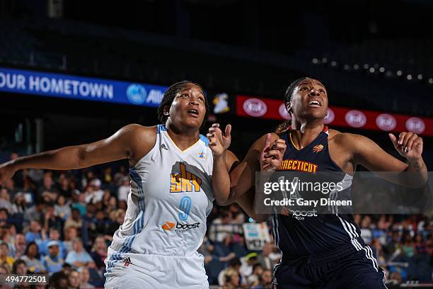 Markeisha Gatling of the Chicago Sky and Kelsey Bone of the Connecticut Suns battle for the rebound on May 30, 2013 at the Allstate Arena in...