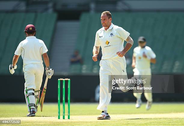 John Hastings of Victoria celebrates after dismissing Nathan Reardon of Queensland during day two of the Sheffield Shield match between Victoria and...
