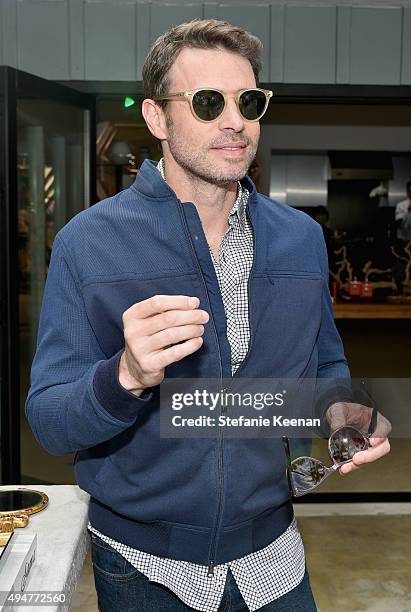 Actor Scott Foley, trying on Sama Eyewear, attends the Vince Camuto Mens exclusive preview at the home of Ashlee Margolis on October 28, 2015 in...