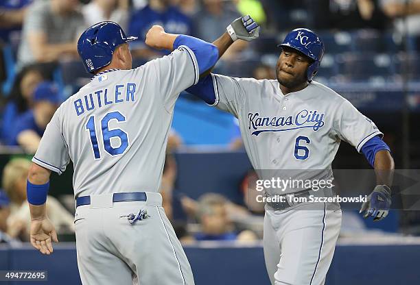 Lorenzo Cain of the Kansas City Royals celebrates his two-run home run with Billy Butler in the eighth inning during MLB game action against the...