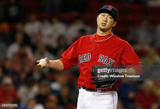 Junichi Tazawa of the Boston Red Sox on the mound against the Tampa Bay Rays during the eighth inning of the game at Fenway Park on May 30, 2014 in...