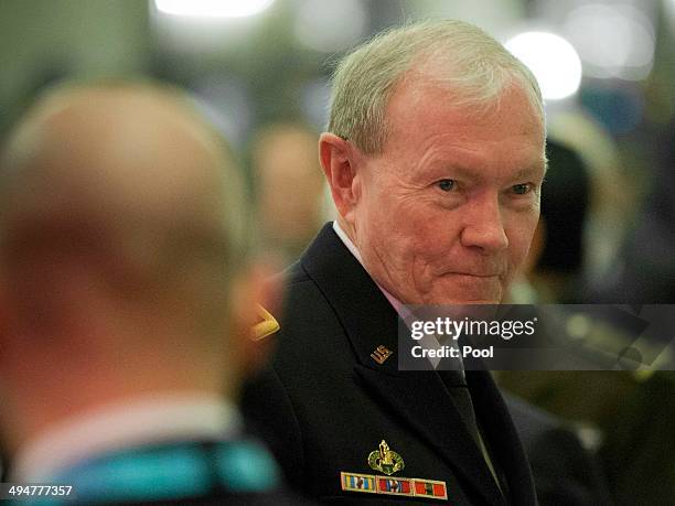 Gen. Martin Dempsey, U.S. Chairman of the Joint Chiefs of Staff, listens asU.S. Defense Secretary Chuck Hagel speaks at the opening plenary meeting...