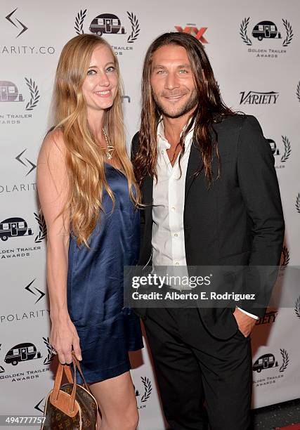 Emily Johnson and actor Zach McGowan attend the 15th Annual Golden Trailer Awards at Saban Theatre on May 30, 2014 in Beverly Hills, California.