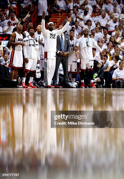 LeBron James of the Miami Heat celebrates against the Indiana Pacers during Game Six of the Eastern Conference Finals of the 2014 NBA Playoffs at...