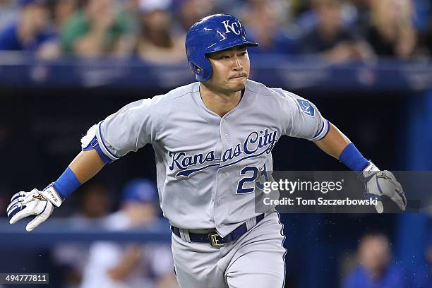 Norichika Aoki of the Kansas City Royals runs to first base after hitting a single in the seventh inning during MLB game action against the Toronto...