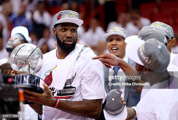 Greg Oden of the Miami Heat holds the trophy after defeating the Indiana Pacers in Game Six of the Eastern Conference Finals of the 2014 NBA Playoffs...