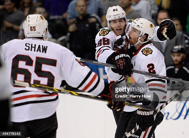 Duncan Keith of the Chicago Blackhawks celebrates with Patrick Kane after Keith scores a third period goal against the Los Angeles Kings in Game Six...