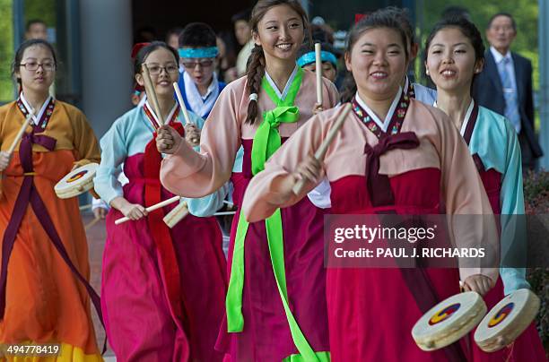 Group of young US born Korean performers dance-in as part of a ribbon cutting opening at the Comfort Women Memorial Peace Garden May 30, 2014 on the...