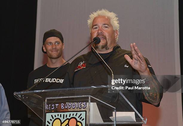 Chef Guy Fieri speaks on stage at the Tom Brady Football Challenge for the Best Buddies Challenge: Hyannis Port at Harvard University on May 30, 2014...