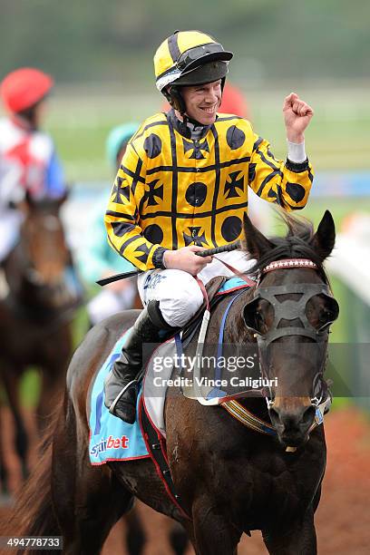 John Allen riding Gotta Take Care after winning Race 4, The Australian Hurdle during Melbourne Racing at Sandown Lakeside on May 31, 2014 in...