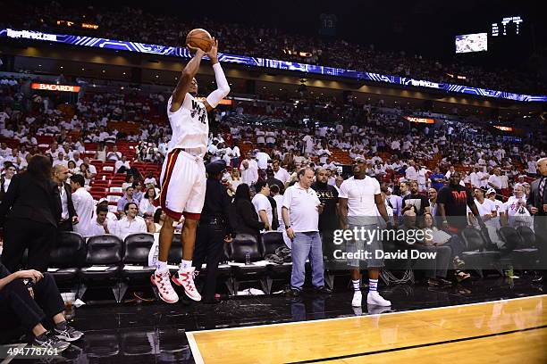 Ray Allen of the Miami Heat warms up before the game against the Indiana Pacers as boxer Floyd Mayweather watches in Game Six of the Eastern...