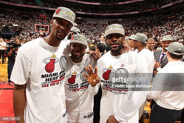 Chris Bosh, Dwyane Wade, and LeBron James of the Miami Heat celebrate after Game Six of the Eastern Conference Finals against the Indiana Pacers...