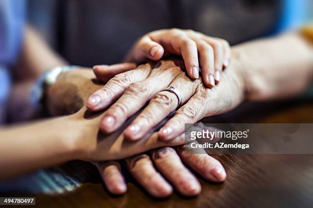 family - hands embracing stock pictures, royalty-free photos & images
