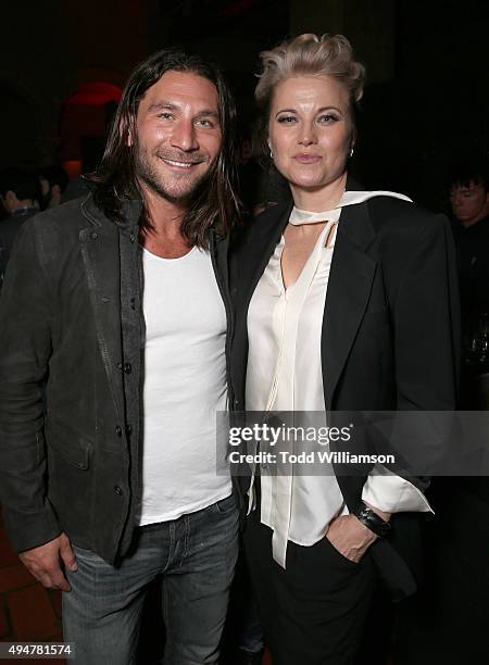 Zach McGowan and Lucy Lawless attend the after party for the Premiere Of STARZ's "Ash vs Evil Dead" at Teddy's on October 28, 2015 in Hollywood,...