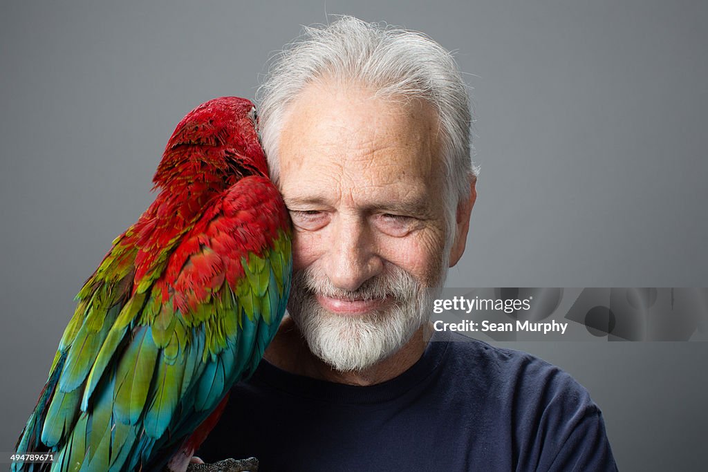 Red-and-green Macaw Hugging Man