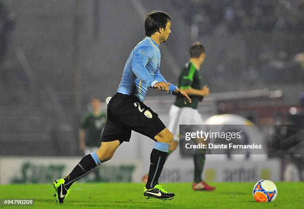 Diego Lugano of Uruguay drives the ball during the International Friendly match between Uruguay and Northern Ireland on May 30, 2014 in Montevideo,...