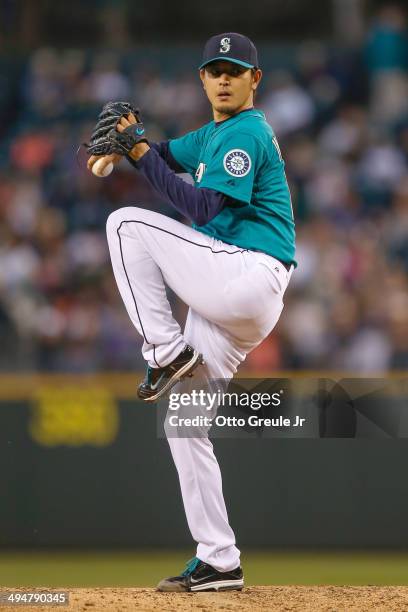 Starting pitcher Hisashi Iwakuma of the Seattle Mariners pitches in the sixth inning against the Detroit Tigers at Safeco Field on May 30, 2014 in...