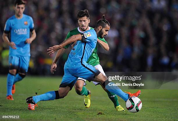 Douglas Pereira dos Santos of FC Barcelona cuts off Tapia of C.F. Villanovense during of the Copa del Rey Last of 16 First Leg match between C.F....
