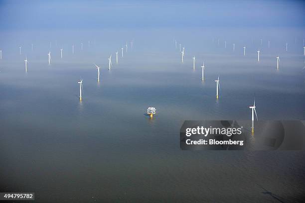 Wind turbines sit in the North Sea at the London Array offshore wind farm, a partnership between Dong Energy A/S, E.ON AG and Abu Dhabi-based Masdar,...