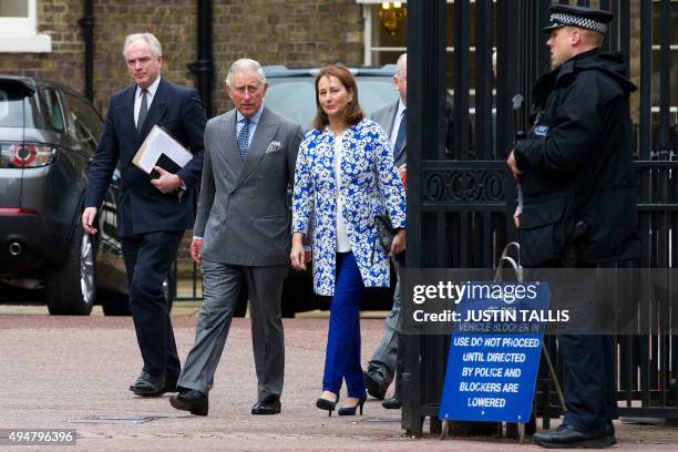 French minister for Ecology, Sustainable Development and Energy, Segolene Royal , and Britain's Prince Charles, Prince of Wales arrive for a meeting...