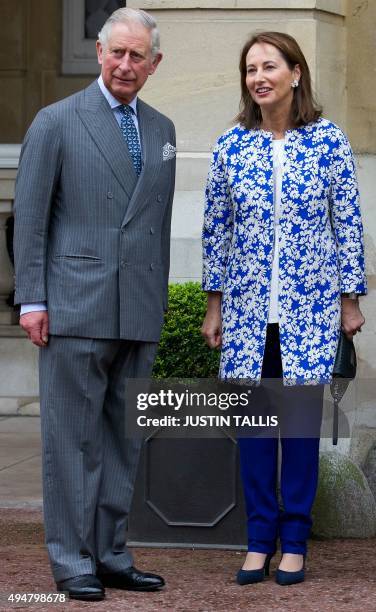 French minister for Ecology, Sustainable Development and Energy, Segolene Royal , and Britain's Prince Charles, Prince of Wales , pose for...