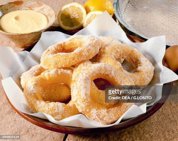 St Joseph's taralli, fried pastry rings dusted with icing sugar.