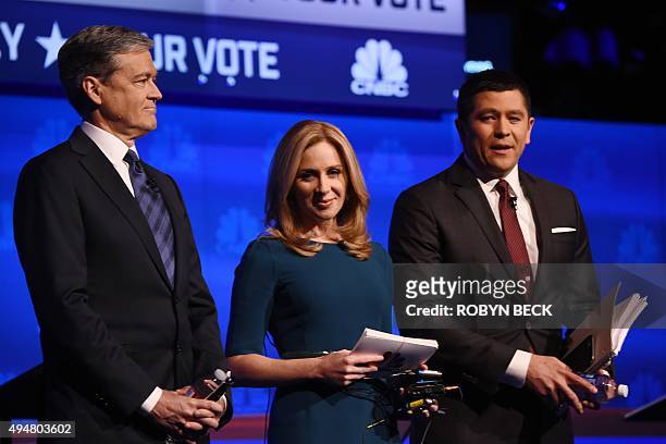 Debate moderators John Harwood , Becky Quick and Carl Quintanilla take the stage at the third Republican Presidential Debate hosted by CNBC, October...