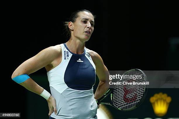 Flavia Pennetta of Italy reacts in her round robin match against Maria Sharapova of Russia during the BNP Paribas WTA Finals at Singapore Sports Hub...