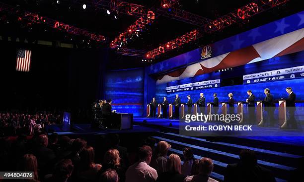 Debate moderators at left John Harwood, Becky Quick and Carl Quintanilla question candidates at the third Republican Presidential Debate hosted by...