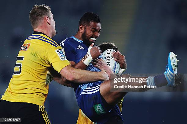 Lolagi Visinia of the Blues charges forward during the round 16 Super Rugby match between the Blues and the Hurricanes at Eden Park on May 31, 2014...