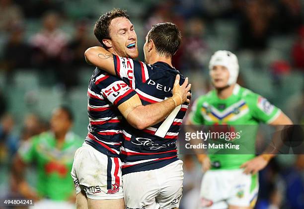 James Maloney of the Roosters celebrates with Mitchell Pearce after scoring a try during the round 12 NRL match between the Sydney Roosters and the...