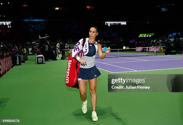 Flavia Pennetta of Italy walks off court after being defeated by Maria Sharapova of Russia in a staight set victory during the BNP Paribas WTA Finals...