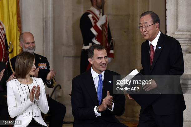 Secretary-General of the United Nations Ban Ki-moon is applauded by Spain's King Felipe VI and Spain's Queen Letizia after a speech at the Royal...