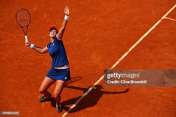 Maria Teresa Torro Flor of Spain serves during her women's singles match against Simona Halep of Romania on day seven of the French Open at Roland...