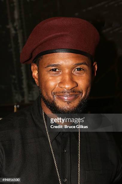 Usher poses backstage at the hit musical "Hamilton" on Broadway at The Richard Rogers Theater on October 28, 2015 in New York City.