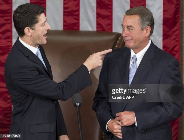 Newly elected Speaker of the House Paul Ryan, Republican of Wisconsin, jokes about crying with outgoing Speaker John Boehner, Republican of Ohio,...