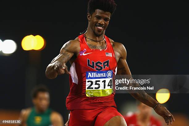 Richard Browne of the United States celebrates setting a new world record and winning the men's 100m T44 final during the Evening Session on Day...