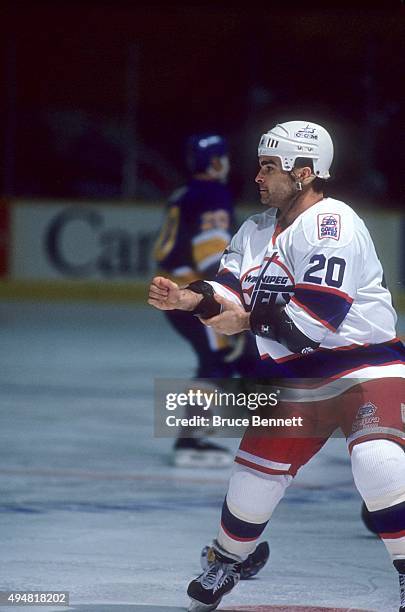 Tie Domi of the Winnipeg Jets gets ready to fight Basil McRae of the St. Louis Blues during an NHL game on November 3, 1993 at the Winnipeg Arena in...