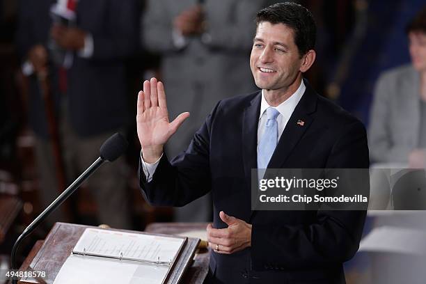 Speaker-elect of the House Paul Ryan waves to his supportes, guests and members of his family in the House chamber at the U.S. Capitol October 29,...