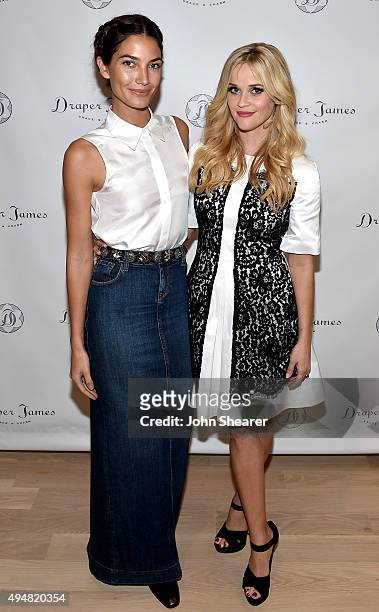 Lily Aldridge and Reese Witherspoon attend the Draper James Nashville store opening on October 28, 2015 in Nashville, Tennessee.