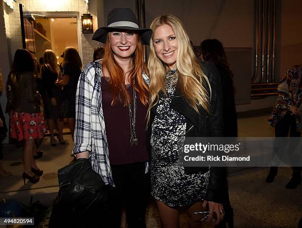 Hilary Williams and Holly Williams attend the Draper James Nashville store opening on October 28, 2015 in Nashville, Tennessee.