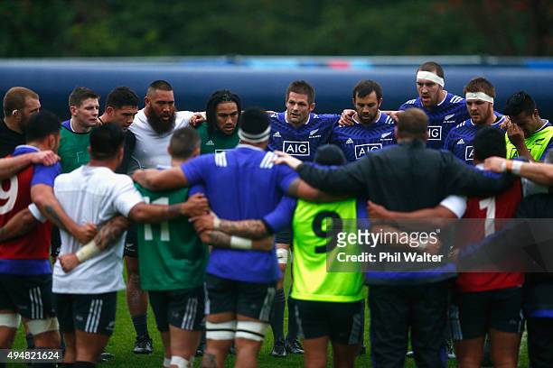 Richie McCaw of the All Blacks talks to the team during a New Zealand All Blacks training session on October 29, 2015 in Bagshot, United Kingdom.