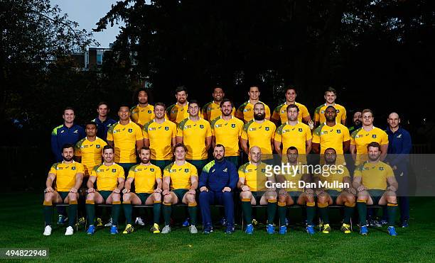 The Australia team named for the 2015 Rugby World Cup Final against New Zealand pose for a photo with coaching staff during an Australia media...