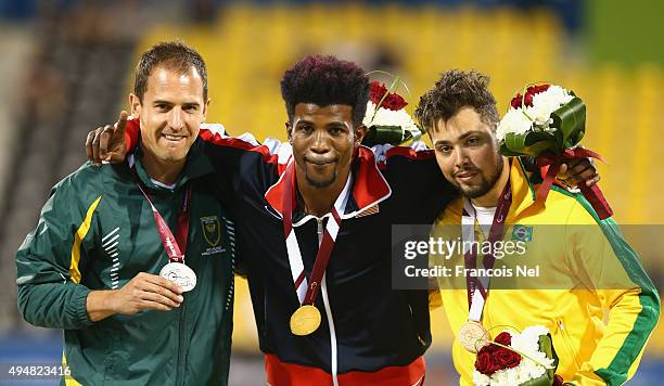 Richard Browne of the United States poses with his gold meda, Arnu Fourie of South Africa silver and Alan Oliveira of Brazil bronze for the men's...