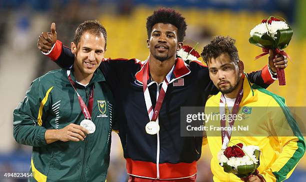 Richard Browne of the United States poses with his gold meda, Arnu Fourie of South Africa silver and Alan Oliveira of Brazil bronze for the men's...